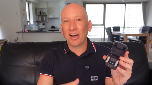 Reviewer wearing Techmi Face Pro hearing aids at a place